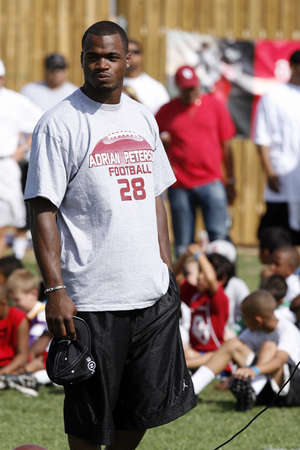 adrian peterson football camp for kids